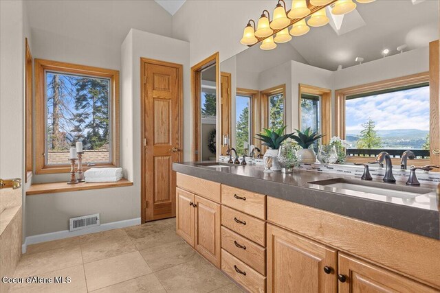 3677 S Capeview Ct, Coeur Dalene, ID 83814 - full bath featuring a sink, lofted ceiling with skylight, and visible vents