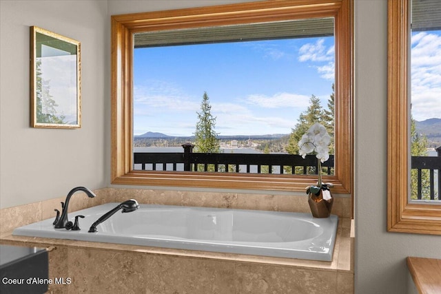 3677 S Capeview Ct, Coeur Dalene, ID 83814 - full bathroom featuring a garden tub and a mountain view