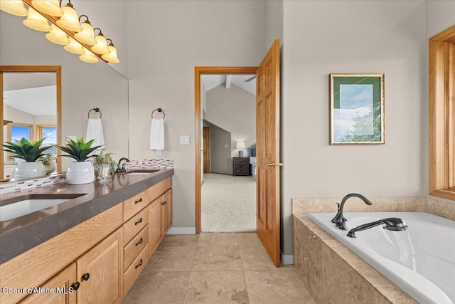3677 S Capeview Ct, Coeur Dalene, ID 83814 - bathroom with double vanity, a sink, a bath, and ensuite bath