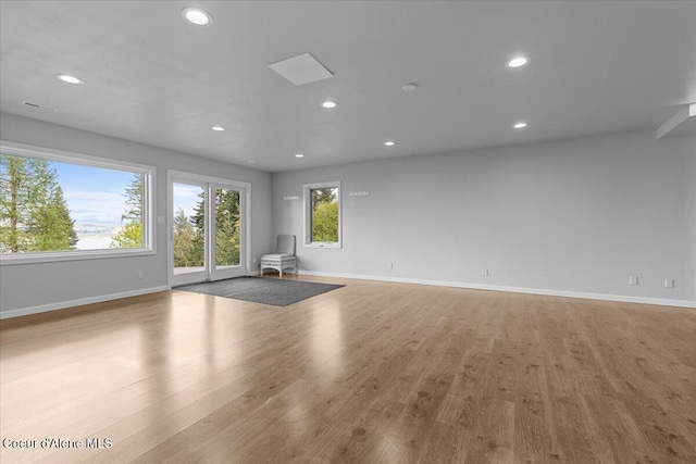 3677 S Capeview Ct, Coeur Dalene, ID 83814 - unfurnished living room with baseboards, recessed lighting, and wood finished floors