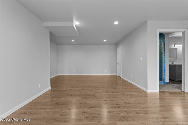 3677 S Capeview Ct, Coeur Dalene, ID 83814 - empty room with baseboards, recessed lighting, and wood finished floors