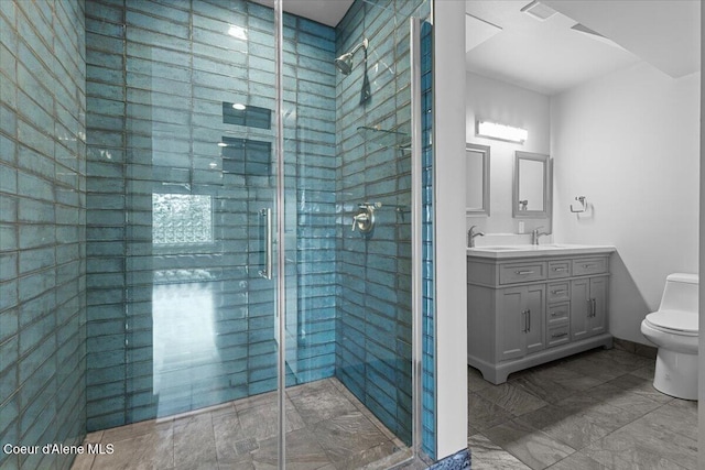 3677 S Capeview Ct, Coeur Dalene, ID 83814 - bathroom with vanity, a stall shower, and toilet