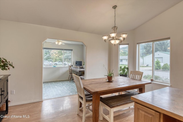 3310 N 17th St, Coeur Dalene, ID 83815 - dining room with a chandelier, baseboards, a ceiling fan, light wood finished floors, and arched walkways
