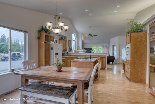 3310 N 17th St, Coeur Dalene, ID 83815 - dining room featuring a ceiling fan, light wood-style floors, a chandelier, recessed lighting, and high vaulted ceiling
