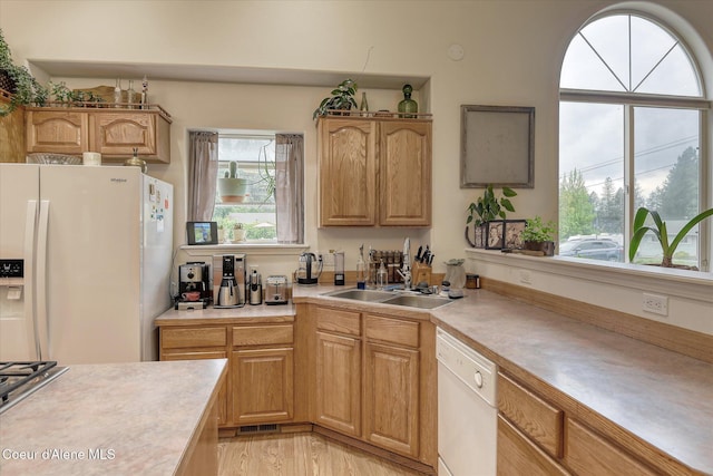 3310 N 17th St, Coeur Dalene, ID 83815 - kitchen with white appliances, light countertops, and healthy amount of natural light