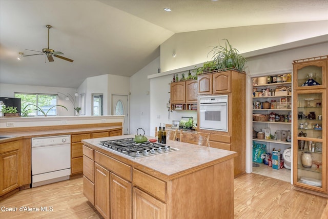 3310 N 17th St, Coeur Dalene, ID 83815 - kitchen featuring white appliances, lofted ceiling, a ceiling fan, light wood-type flooring, and light countertops