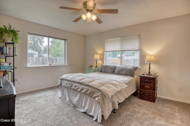 3310 N 17th St, Coeur Dalene, ID 83815 - bedroom featuring multiple windows, carpet flooring, baseboards, and a ceiling fan