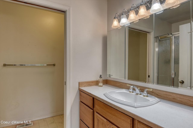3310 N 17th St, Coeur Dalene, ID 83815 - bathroom with vanity, an enclosed shower, and baseboards