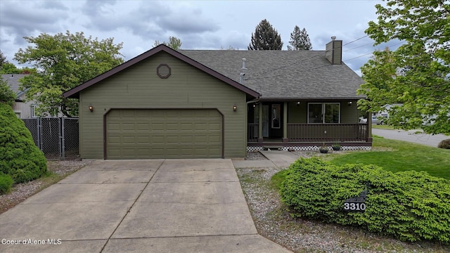 3310 N 17th St, Coeur Dalene, ID 83815 - view of front of home featuring covered porch, roof with shingles, concrete driveway, an attached garage, and a chimney