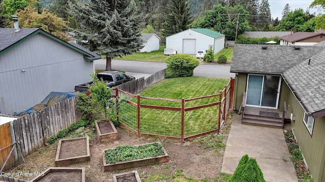 3310 N 17th St, Coeur Dalene, ID 83815 - view of yard featuring a vegetable garden and entry steps