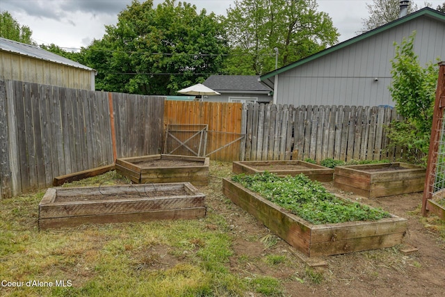 3310 N 17th St, Coeur Dalene, ID 83815 - view of yard featuring a garden