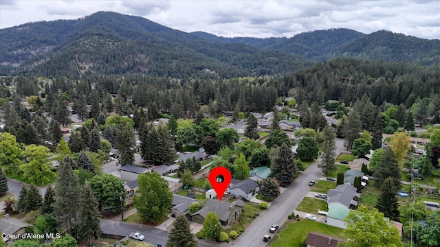 3310 N 17th St, Coeur Dalene, ID 83815 - aerial perspective of suburban area featuring mountains and a forest