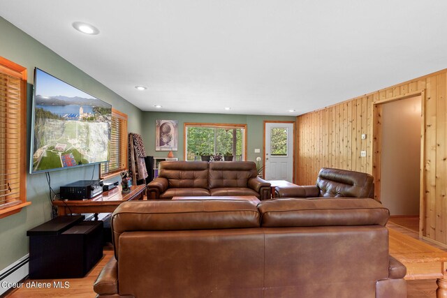 14105 E Marie Creek Rd, Coeur Dalene, ID 83814 - living room featuring wood walls, wood finished floors, recessed lighting, and a baseboard heating unit