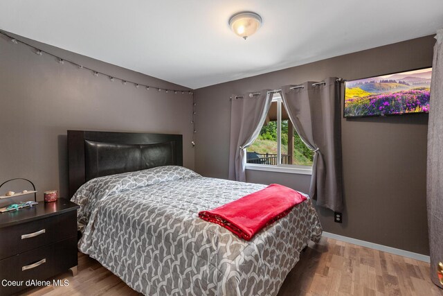 14105 E Marie Creek Rd, Coeur Dalene, ID 83814 - bedroom featuring wood finished floors