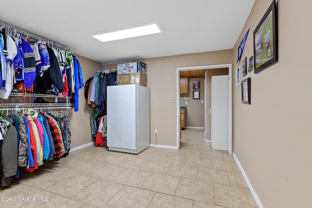 14105 E Marie Creek Rd, Coeur Dalene, ID 83814 - walk in closet featuring light tile patterned flooring