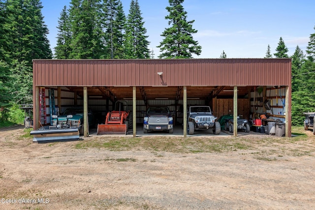 14105 E Marie Creek Rd, Coeur Dalene, ID 83814 - view of parking / parking lot with a carport and an outbuilding
