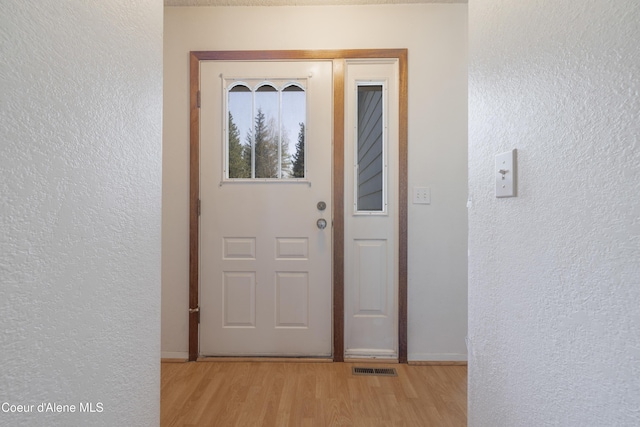 property entrance featuring visible vents