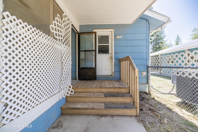 property entrance with central AC and fence