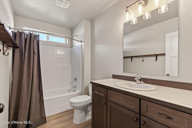 bathroom featuring vanity, toilet, shower / bath combo with shower curtain, wood finished floors, and visible vents