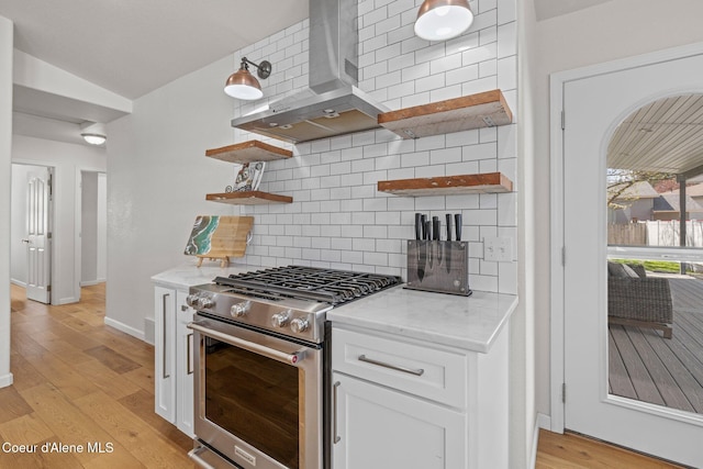 3515 N 7th St, Coeur Dalene, ID 83815 - kitchen with open shelves, gas stove, backsplash, white cabinetry, and light wood finished floors