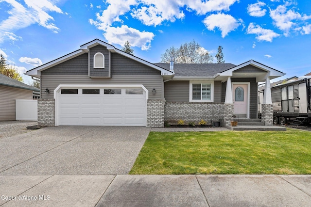 3515 N 7th St, Coeur Dalene, ID 83815 - view of front of home featuring brick siding, an attached garage, concrete driveway, and a front yard