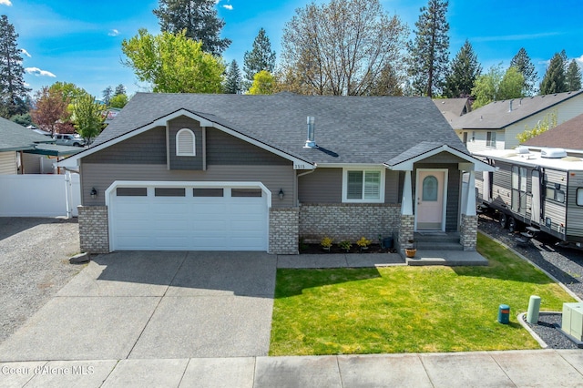 3515 N 7th St, Coeur Dalene, ID 83815 - view of front facade featuring brick siding, an attached garage, concrete driveway, and roof with shingles