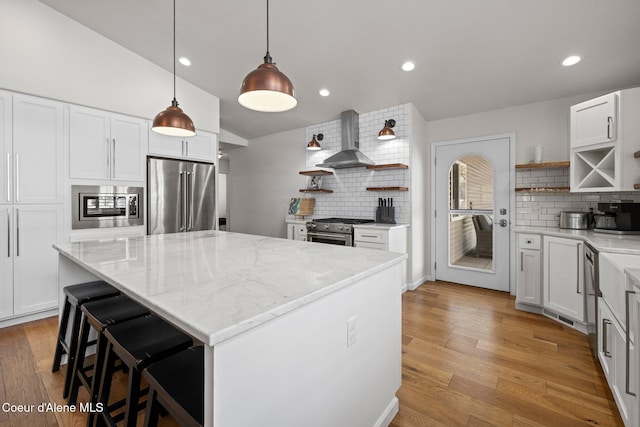 3515 N 7th St, Coeur Dalene, ID 83815 - kitchen featuring open shelves, premium appliances, wall chimney range hood, backsplash, and recessed lighting