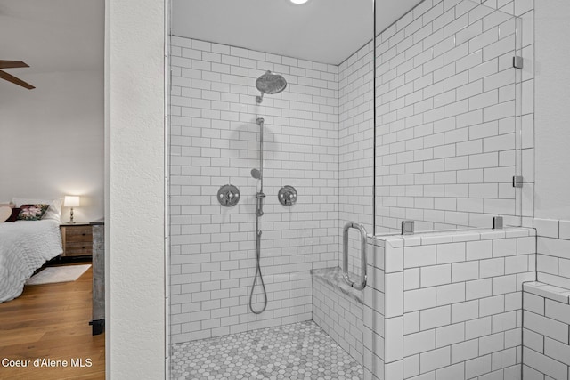 3515 N 7th St, Coeur Dalene, ID 83815 - bathroom with a stall shower, a ceiling fan, wood finished floors, and ensuite bathroom