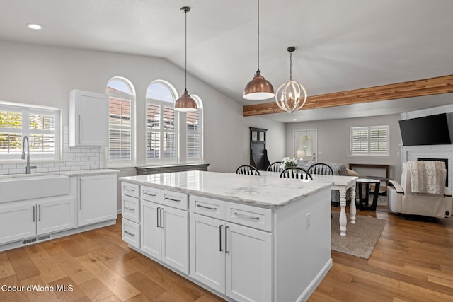 3515 N 7th St, Coeur Dalene, ID 83815 - kitchen with a sink, light wood finished floors, white cabinetry, a kitchen island, and recessed lighting