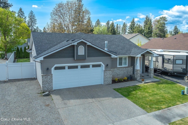 3515 N 7th St, Coeur Dalene, ID 83815 - view of front of property featuring an attached garage, driveway, roof with shingles, and brick siding