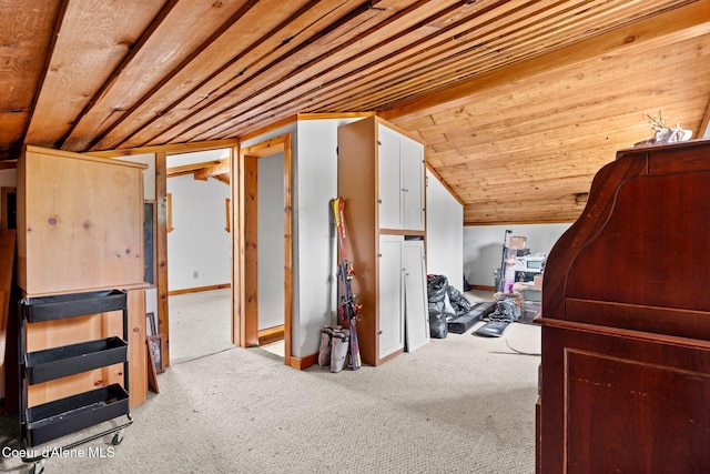 interior space with wooden ceiling, carpet floors, baseboards, and lofted ceiling