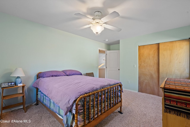 bedroom featuring a closet, carpet flooring, ceiling fan, and baseboards