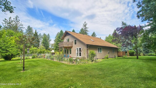 16691 W Hollister Hills Dr, Hauser, ID 83854 - rear view of house with a balcony