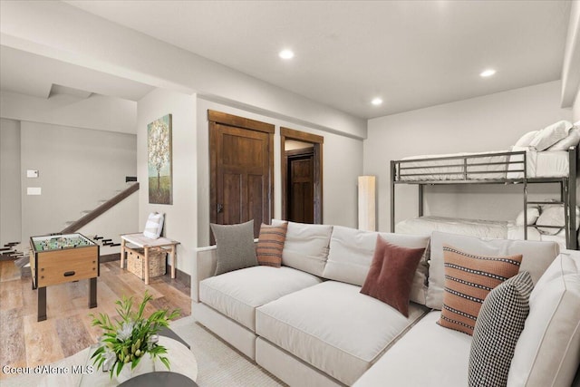 7809 E Bridger Trl, Harrison, ID 83833 - living room featuring recessed lighting, baseboards, stairs, and wood finished floors