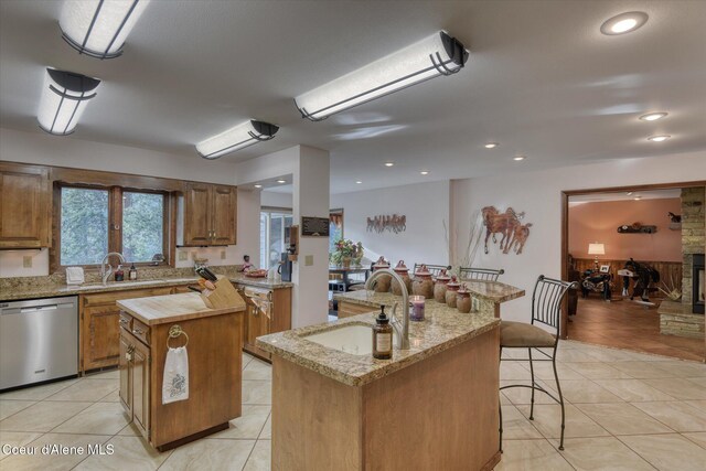 2885 S Folsom Ridge Rd, Coeur Dalene, ID 83814 - kitchen featuring stainless steel dishwasher, a center island, a sink, light tile patterned flooring, and recessed lighting