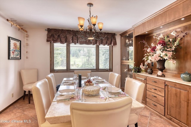 2885 S Folsom Ridge Rd, Coeur Dalene, ID 83814 - dining area with a chandelier and light tile patterned floors