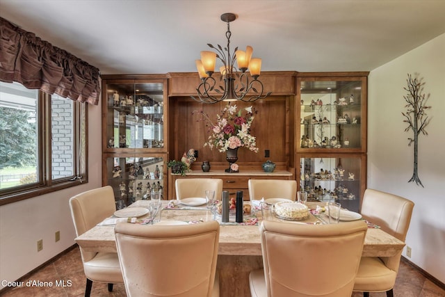 2885 S Folsom Ridge Rd, Coeur Dalene, ID 83814 - dining room with a chandelier and baseboards
