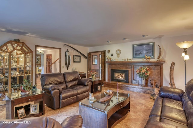 2885 S Folsom Ridge Rd, Coeur Dalene, ID 83814 - living area featuring a glass covered fireplace, stairway, and tile patterned flooring
