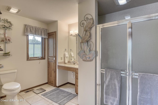 2885 S Folsom Ridge Rd, Coeur Dalene, ID 83814 - full bathroom with a stall shower, tile patterned flooring, toilet, baseboards, and vanity
