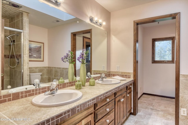 2885 S Folsom Ridge Rd, Coeur Dalene, ID 83814 - full bathroom with toilet, double vanity, and tiled shower