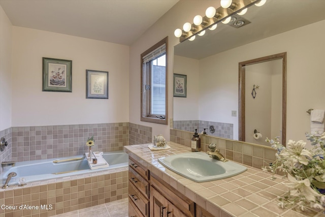 2885 S Folsom Ridge Rd, Coeur Dalene, ID 83814 - full bathroom featuring vanity, a garden tub, and tile patterned floors