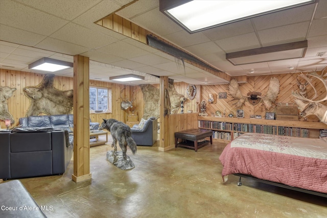 2885 S Folsom Ridge Rd, Coeur Dalene, ID 83814 - bedroom featuring a drop ceiling, wooden walls, and concrete flooring