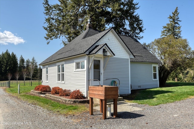 2885 S Folsom Ridge Rd, Coeur Dalene, ID 83814 - view of front of property featuring roof with shingles and a front lawn