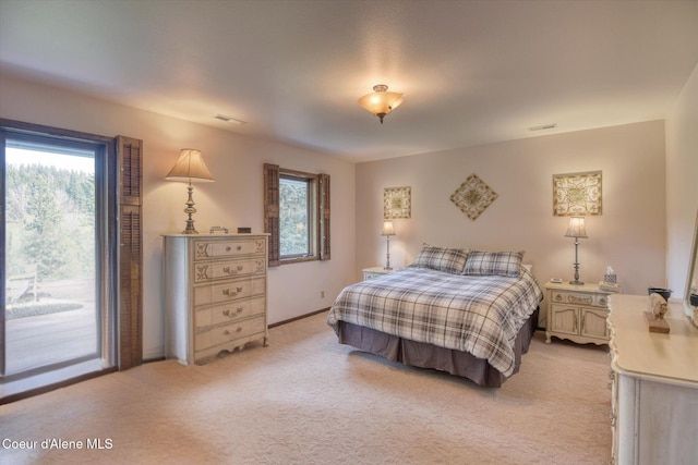 2885 S Folsom Ridge Rd, Coeur Dalene, ID 83814 - bedroom with multiple windows, light carpet, and access to outside