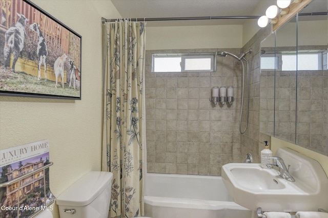 2885 S Folsom Ridge Rd, Coeur Dalene, ID 83814 - bathroom featuring shower / bath combo with shower curtain, a sink, and toilet