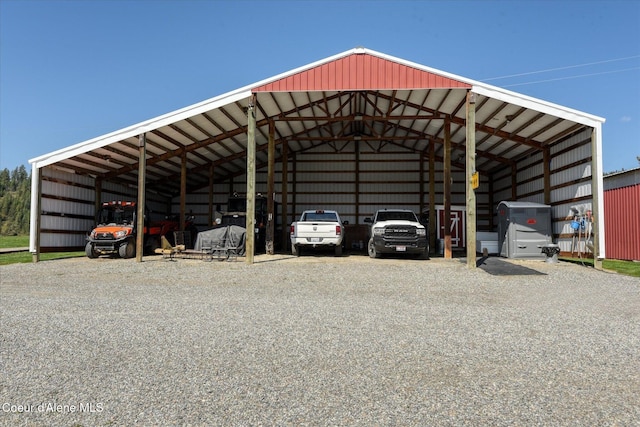 2885 S Folsom Ridge Rd, Coeur Dalene, ID 83814 - view of parking with a carport, an outbuilding, and gravel driveway