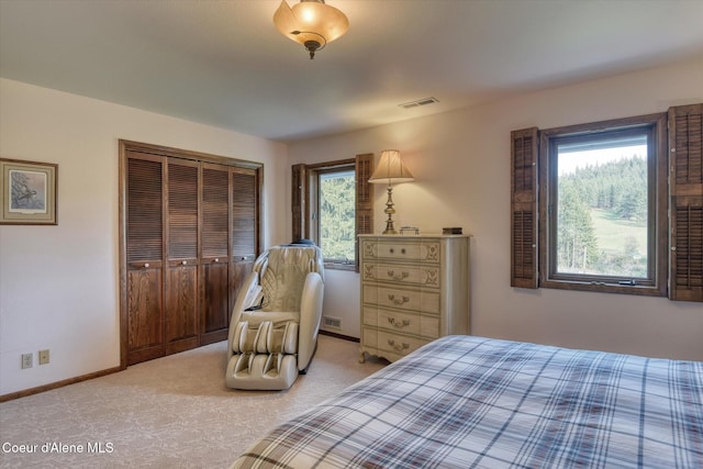 2885 S Folsom Ridge Rd, Coeur Dalene, ID 83814 - bedroom with light colored carpet, a closet, and baseboards