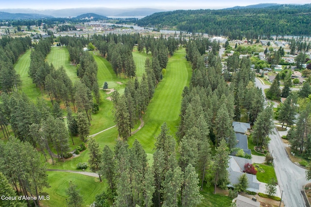 bird's eye view featuring view of golf course and a mountain view