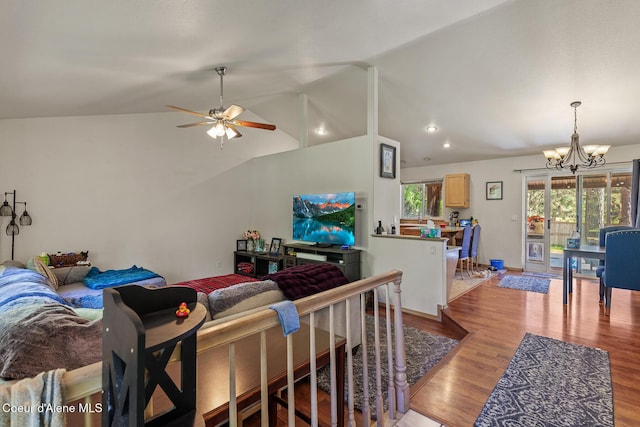living area featuring recessed lighting, ceiling fan with notable chandelier, lofted ceiling, and light wood-style floors
