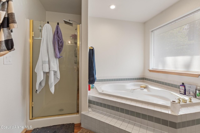 full bathroom featuring a stall shower, recessed lighting, and a garden tub
